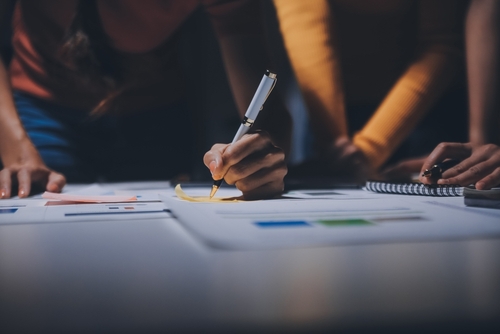 Business,people,working,late,at,laptop,in,highrise,office